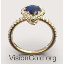 Klassischer Halo-Ring mit blauem Stein in Gelbgold 149KMP