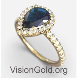 Klassischer Halo-Ring mit blauem Stein in Gelbgold 149KMP