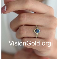 Klassischer Halo-Ring mit blauem Stein in Gelbgold 149KMP