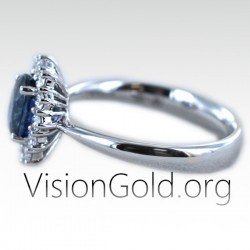 Δαχτυλίδι ροζέτα με οβάλ ζαφείρι και μπριγιάν διαμάντια|